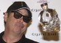 L'attore americano Dan Aykroyd lancia una bottiglia di Vodka Crystal Head durante il photocall di  presentazione della sua vodka a Roma