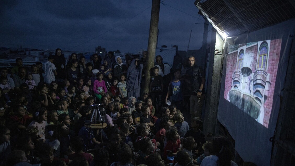 Palestinian man sets up cinema for children at Rafah camp, southern Gaza