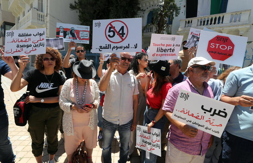 Journalists protest during a press freedom rally in Tunis