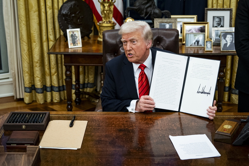 US President Trump signs executive order in Oval Office